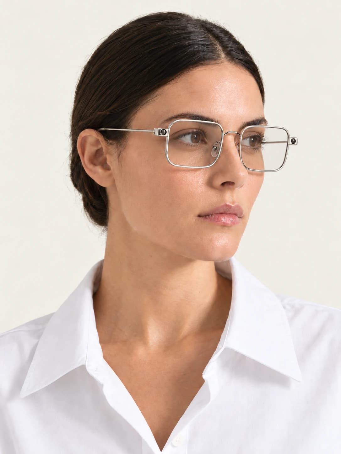 The Pocket in clear, worn by a woman in a white shirt